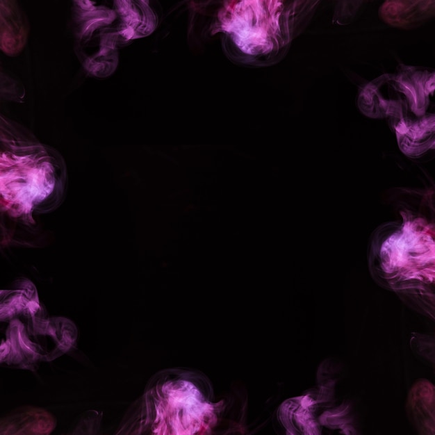 Close-up of purple steam smoke design in circle on black background