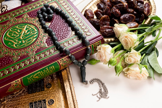 Close up quran and bouquet of flower