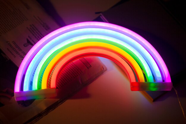 Close up on rainbow neon sign indoors