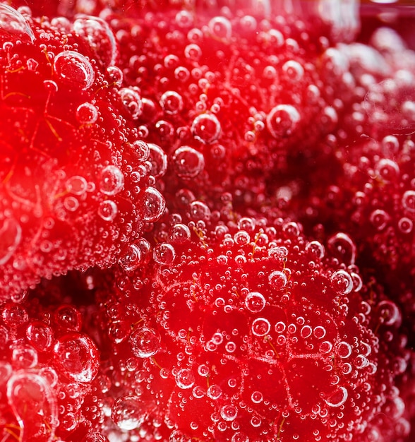 Close-up raspberries with water droplets