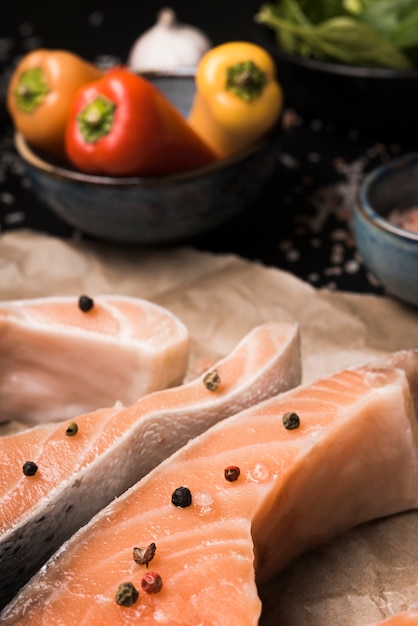 Close-up raw salmon steak with ingredients