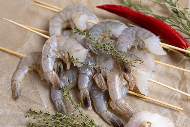 Close up of raw shrimps on a baking paper