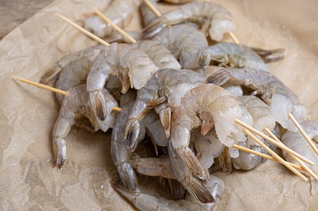 Close up of raw shrimps on a baking paper