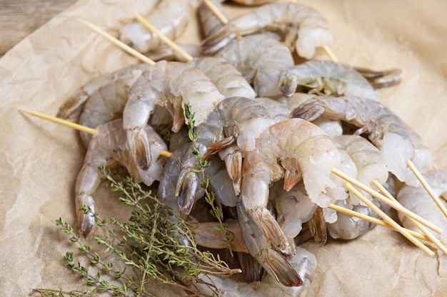 Close up of raw shrimps on a baking paper