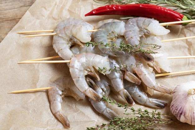 Close up of raw shrimps on a baking paper