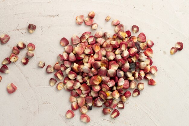 Close-up red corn kernels on table