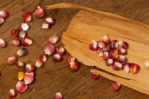 Close-up red corn kernels on table