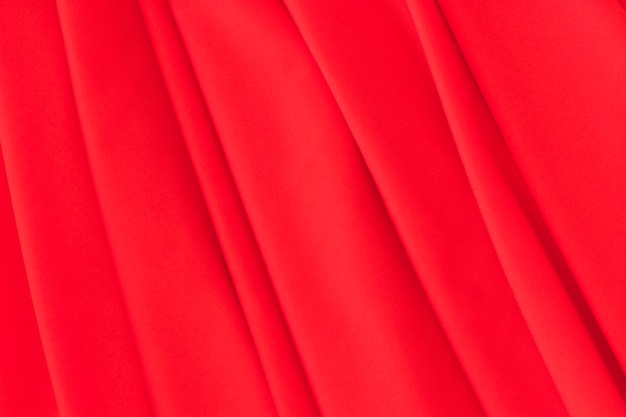 Close-up of red folded fabric background