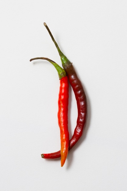 Close-up red hot chili peppers with white background