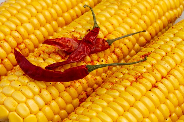 Close-up red hot chilli peppers with corn