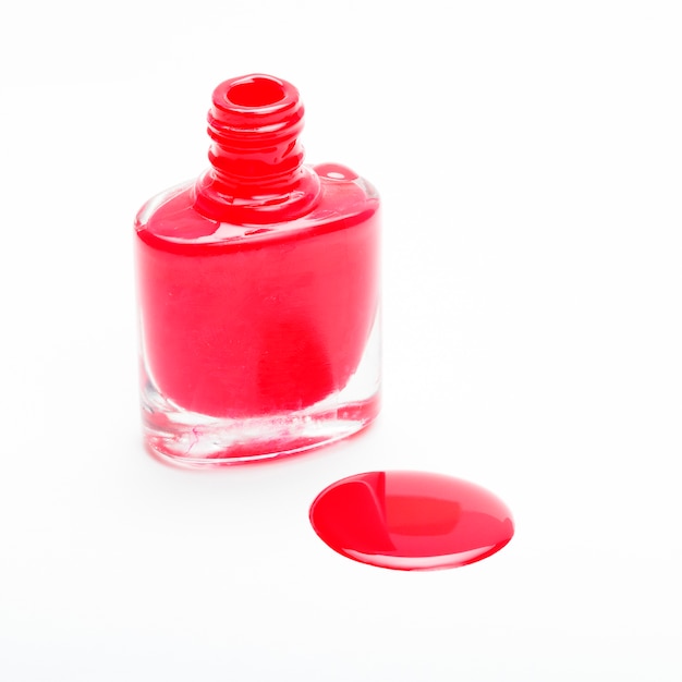 Close-up of red nail polish with droplets