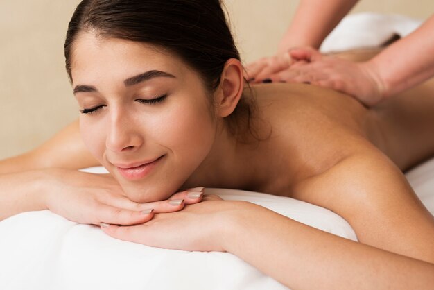 Close-up relaxed girl getting a massage