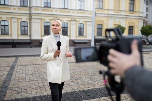 Close up on reporter preparing for an interview