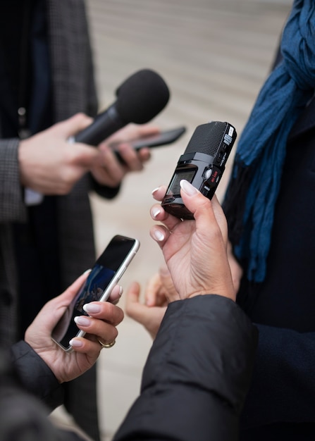 Close up on reporter taking an interview