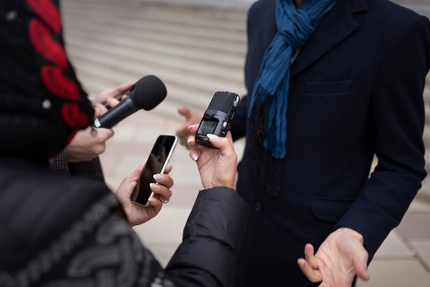 Free photo close up on reporter taking an interview