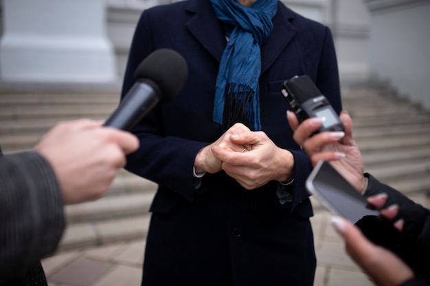 Close up on reporter taking an interview