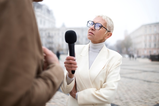 Close up on reporter taking an interview