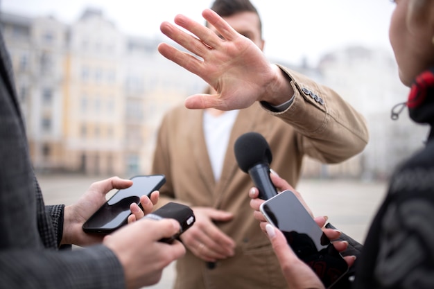 Close up on reporter taking an interview