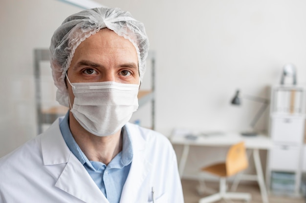 Free photo close up researcher wearing mask