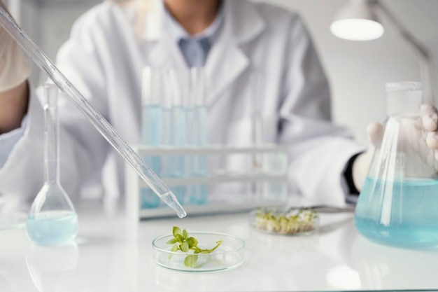 Close up researcher with pipette