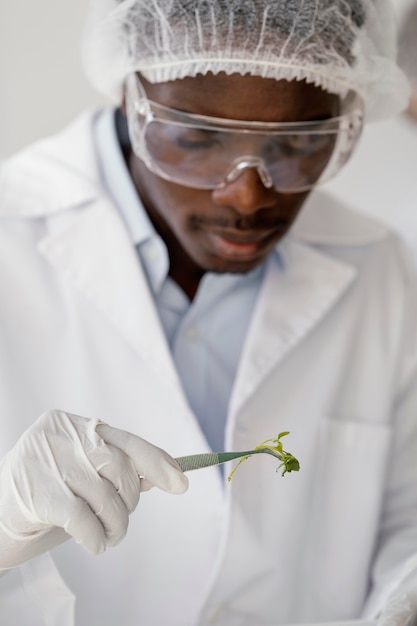 Close up  researcher with tweezers