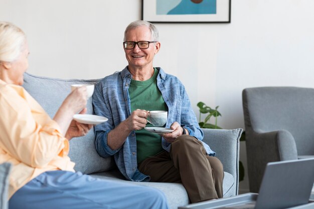 close up retired couple in living room