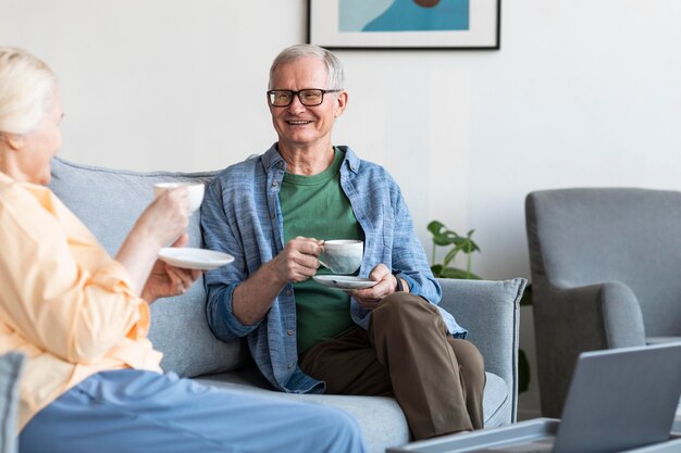 Close up retired couple in living room