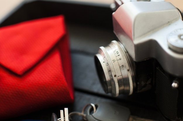 Close-up of retro camera and necktie