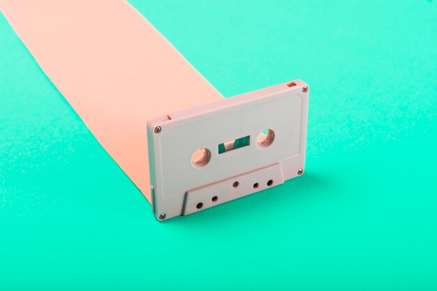 Close-up of retro cassette tape on blue background