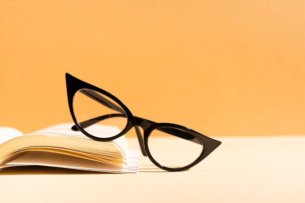 Close-up retro glasses on a book