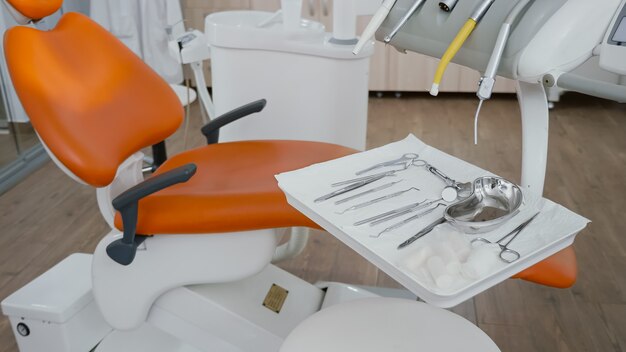 Close up revealing shot of medical dental tools ready for stomatology teeth surgery
