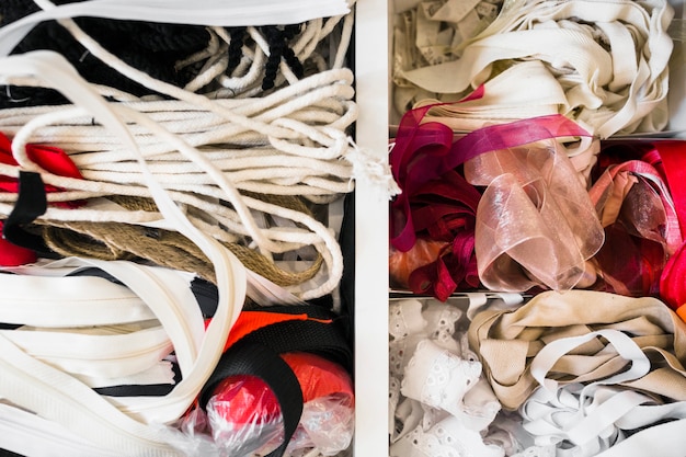 Free photo close-up of ribbons and lace in shelf