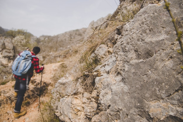 Close-up of rocks with blurred hiker background