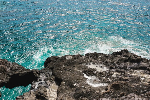 Close-up rocky coast with crystalline water