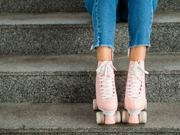 Close-up of roller skates and stairs