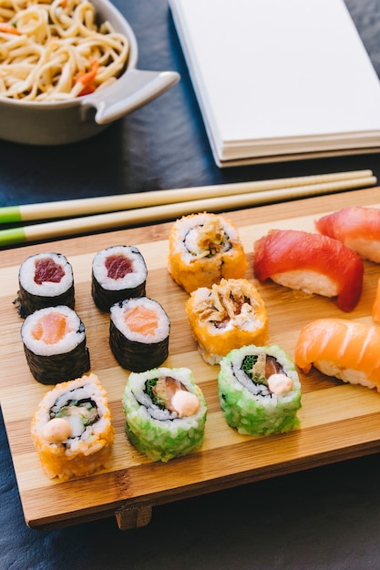 Close-up rolls near chopsticks and notebook