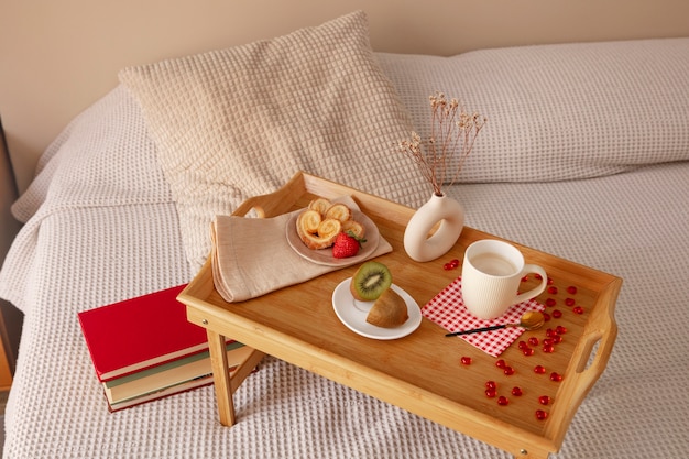 Close up on romantic breakfast in bed arrangement