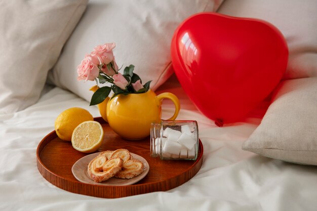 Close up on romantic breakfast bed arrangement