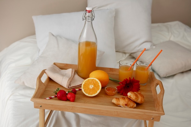 Close up on romantic breakfast bed arrangement