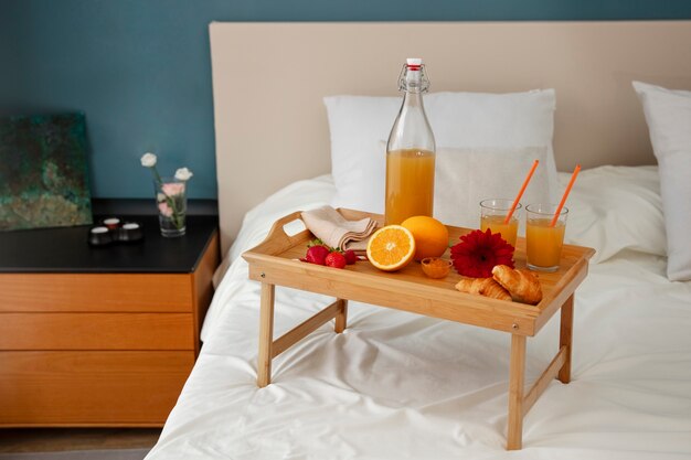 Close up on romantic breakfast bed arrangement