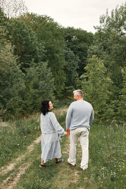 Close up romantic couple walking in an autumn park