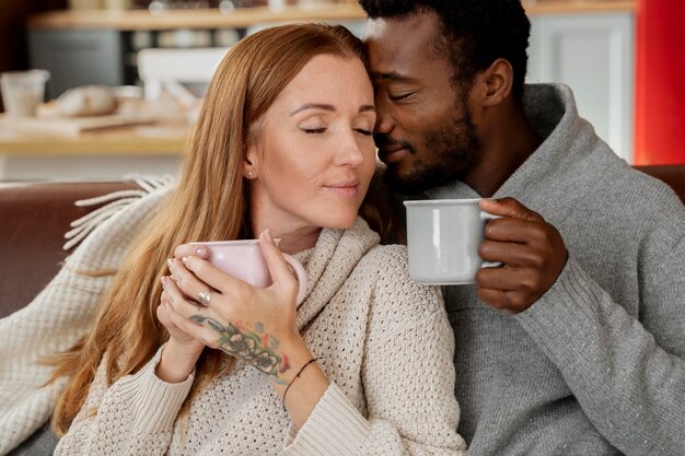 Close up romantic couple with cups