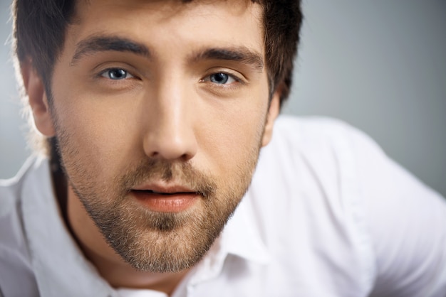 Close-up romantic thoughtful young man look you