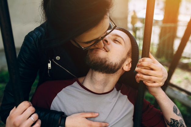 Close-up of romantic woman kissing her boyfriend