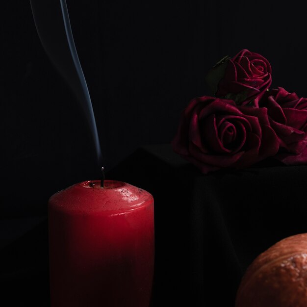 Close-up of roses and candles