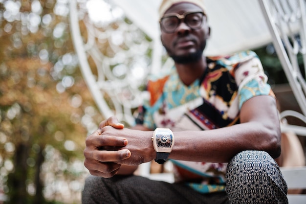 Close up royal watches on hand of rich african american man