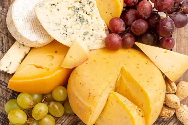 Close-up rustic cheese with grapes