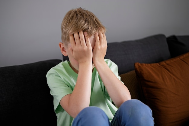 Free photo close up on sad boy portrait