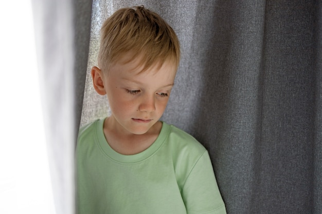 Free photo close up on sad boy portrait