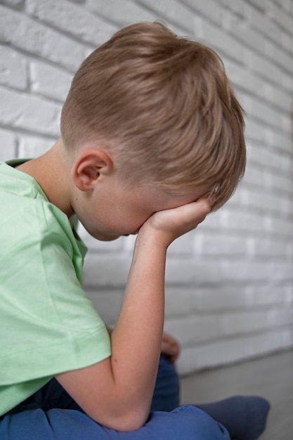 Free photo close up on sad boy portrait